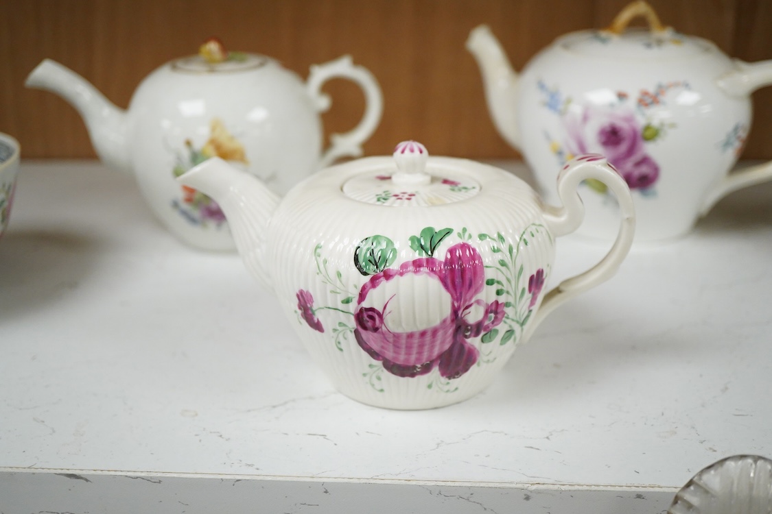 An 18th Furstenburg porcelain teapot and cover, a Wallendorf porcelain teapot and cover and a Meissen style teapot, 12cm high